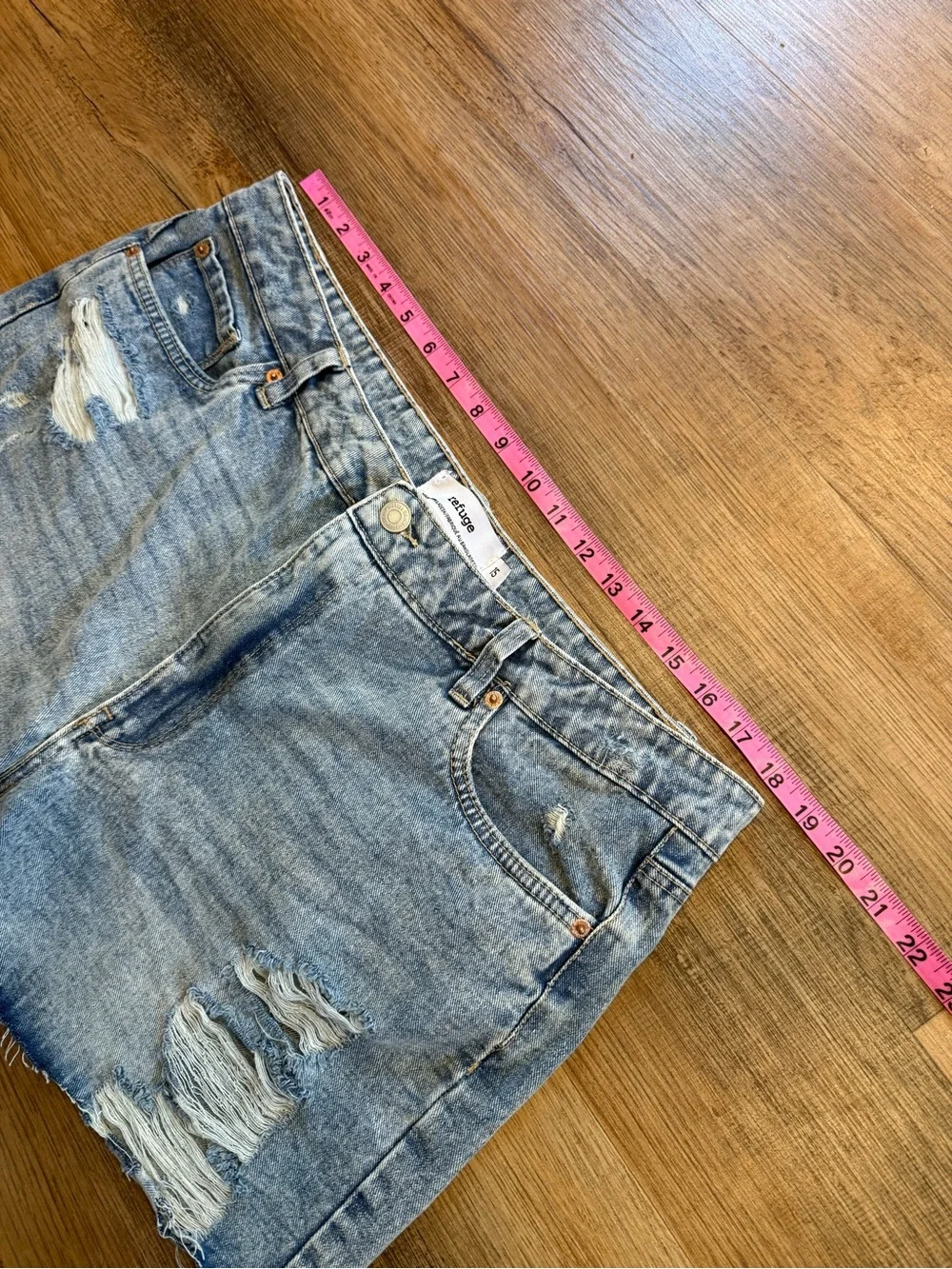refuge light wash distressed denim cutoff shorts